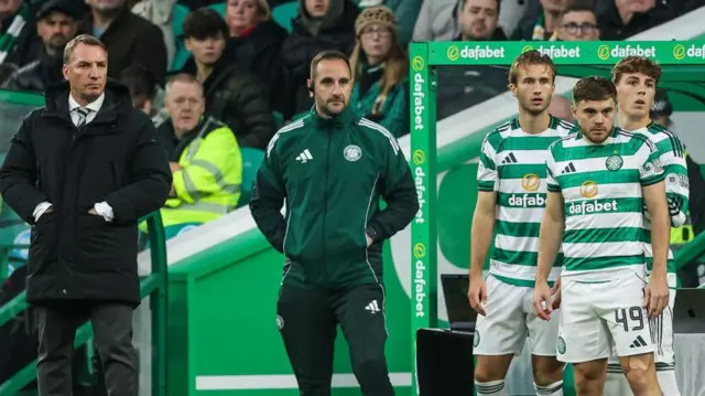 Celtic Manager Brendan Rodgers (L) makes three substitutions as Benjamin Nygren, James Forrest and Arne Engels come on