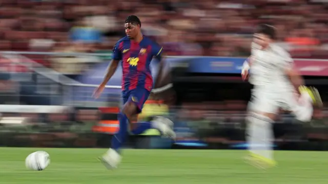 Marcus Rashford runs with the ball against Real Madrid
