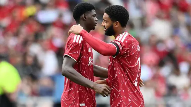 Joe Gomez embraces Mor Talla Ndiaye on the pitch before Liverpool's friendly against Sunderland in Nashville