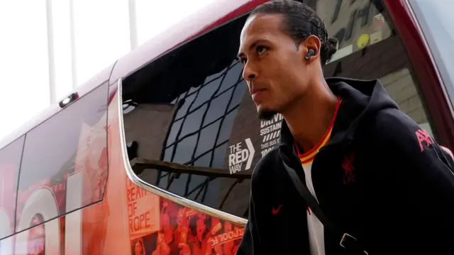 Liverpool captain Virgil van Dijk walks off the team coach before the Premier League match at Wolves