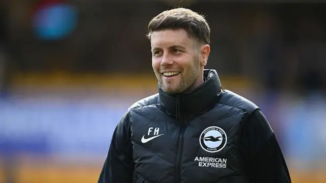 Fabian Hurzeler looks on smiling for Brighton
