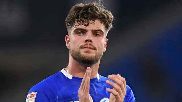 Cardiff City winger Ollie Tanner applauds