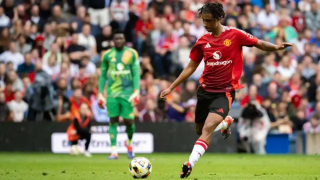 Leny Yoro in action for Manchester United against Rangers