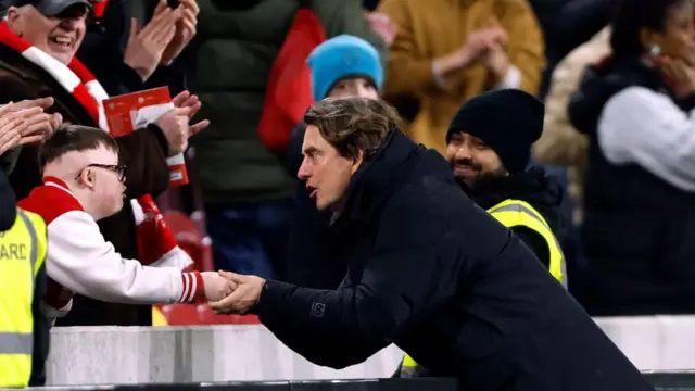 Thomas Frank greets a young Brentford supporter
