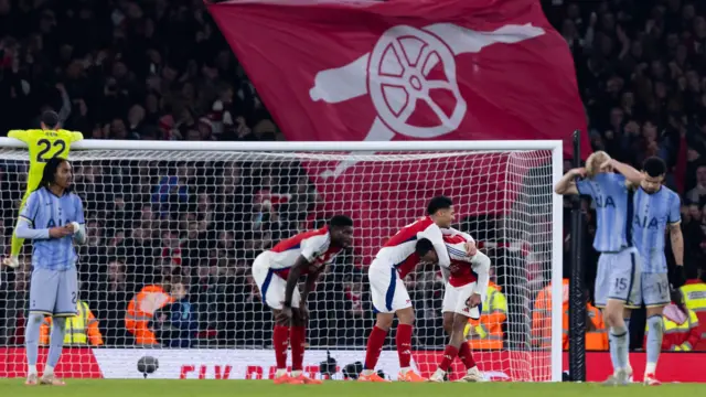 Tottenham players dejected after Arsenal score