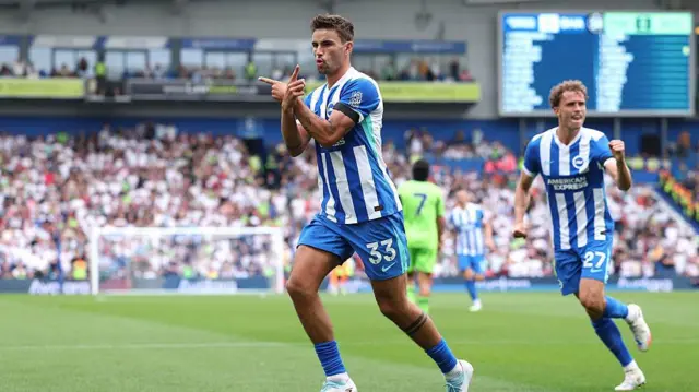 Matt O'Riley of Brighton & Hove Albion celebrates scoring the opening goal from the penalty spot during the Premier League match between Brighton & Hove Albion and Fulham at Amex Stadium