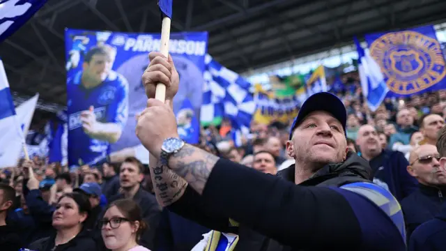 Everton fans wave their flags