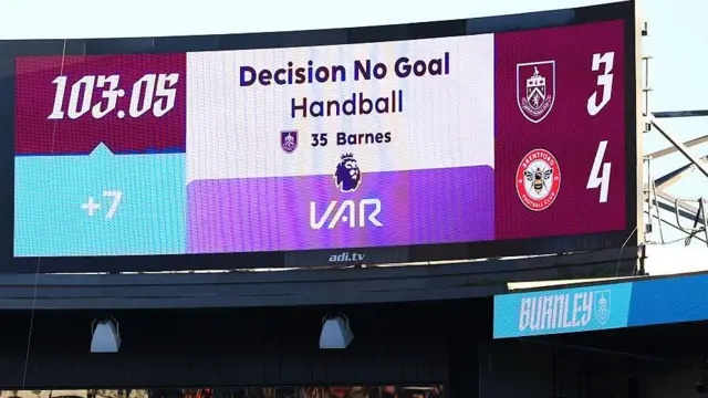Scoreboard at Burnley reads Burnley 3-4 Brentford. Decision No Goal - Handball - Barnes.