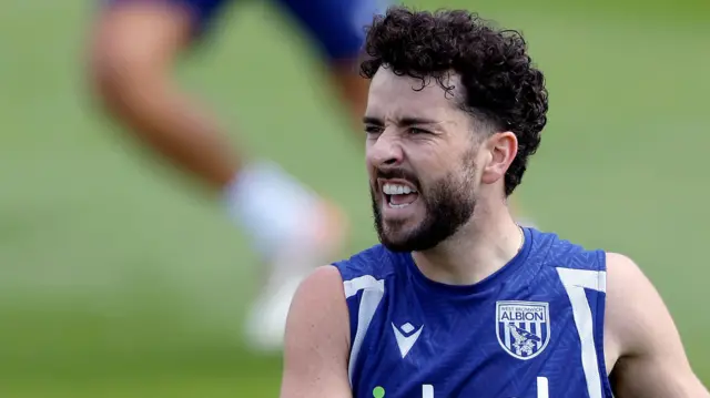 Mikey Johnston, wearing a navy blue West Bromwich Albion training vest, pictured during a training session in July 2026