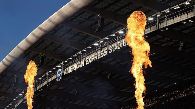 General view inside the Amex Stadium as flares go off