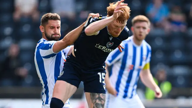 Kilmarnock's Robbie Deas and Dundee's Simon Murray in action 