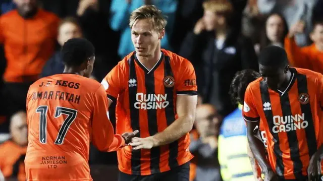 Dundee United's Bert Esselink (centre) celebrates scoring against Aberdeen