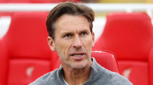 Liverpool manager Gareth Taylor sat in the Anfield dugout