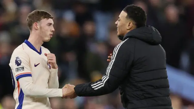 Morgan Rogers of Aston Villa interacts with Cole Palmer of Chelsea