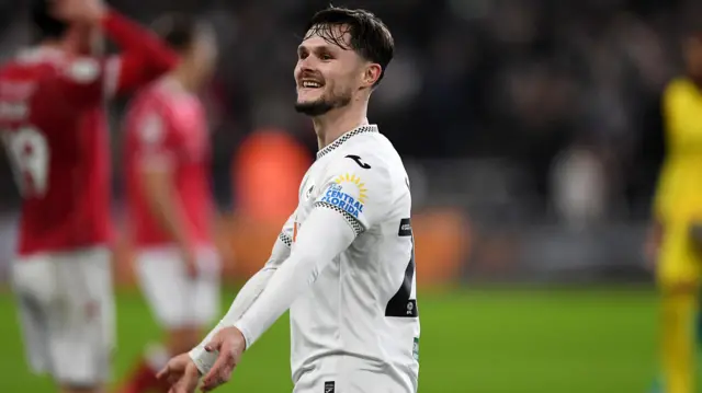 Liam Cullen celebrates Swansea's win over Wrexham last month 