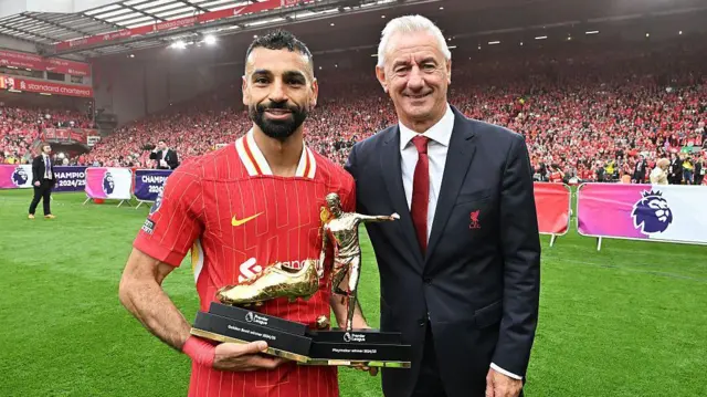 Mohamed Salah with the Gold Boot and Playmaker awards