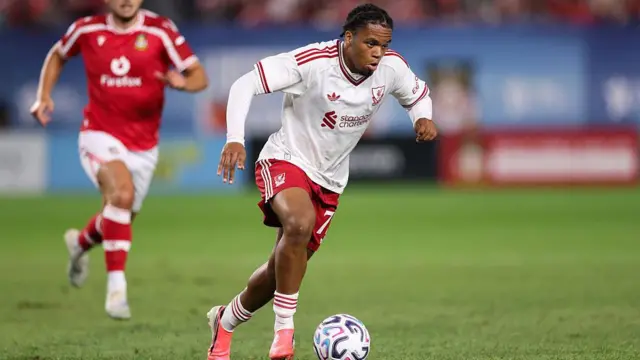 Rio Ngumoha runs with the ball for Liverpool