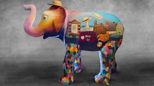 One side of Sunrise the painted elephant statue