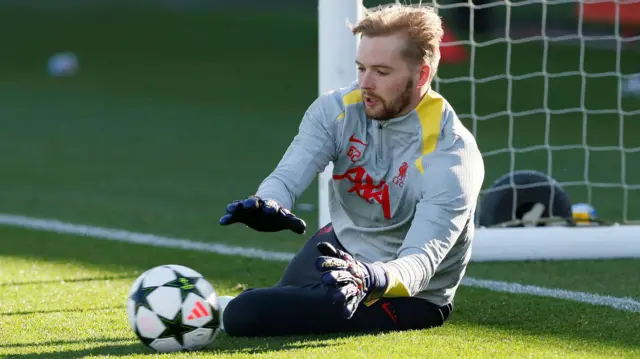 Caoimhin Kelleher saves a shot during a Liverpool training session