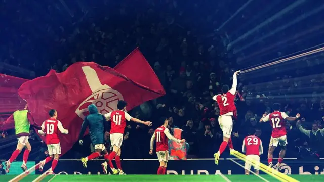 Arsenal players celebrate a goal
