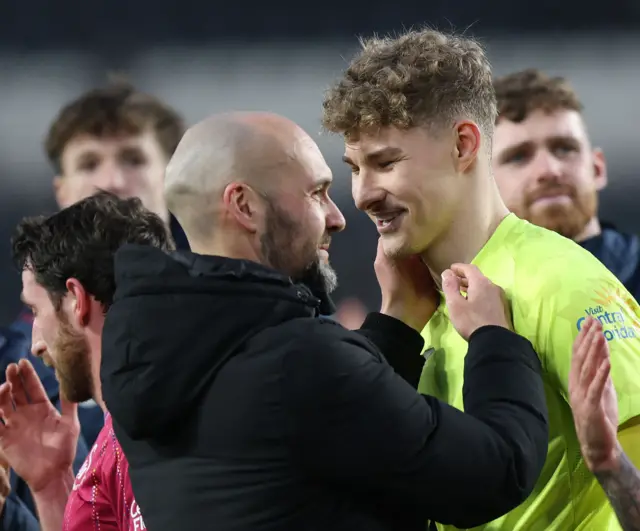 Luke Williams celebrates with Carl Rushworth after victory at Hull