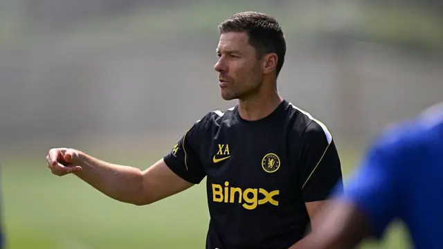 Xabi Alonso waving his arm in Chelsea training 
