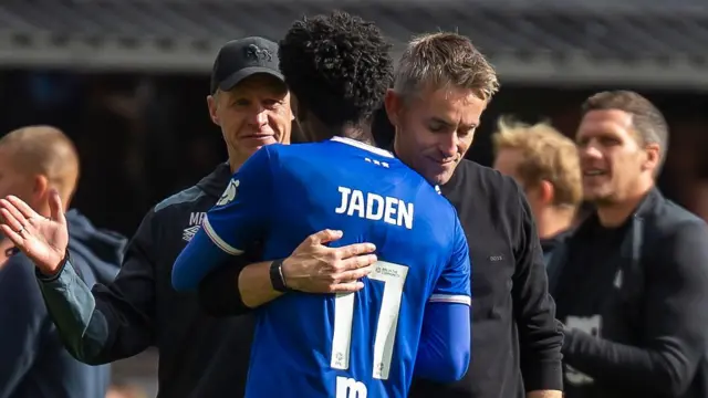 Ipswich Town boss Kieran McKenna embracing winger Jaden Philogene