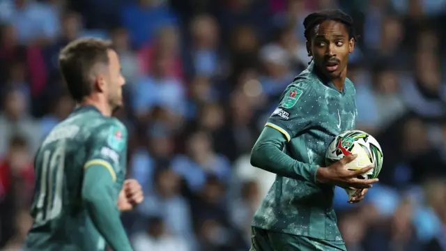 Djed Spence retrieves the ball after scoring against Coventry