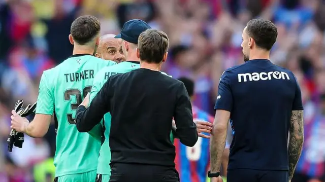 Pep Guardiola approaches Dean Henderson