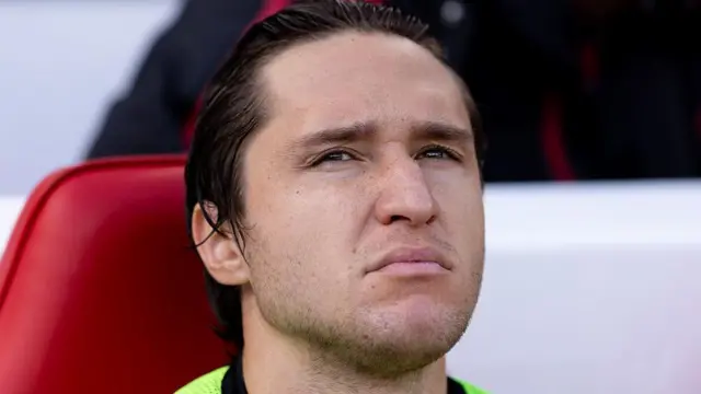 Liverpool's Federico Chiesa sits on the bench prior to a Premier League match