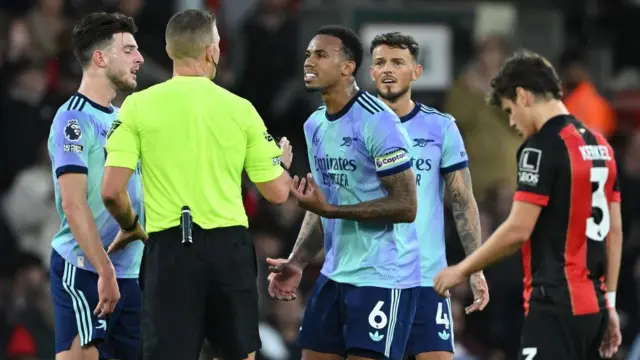 Captain Declan Rice and Gabriel- speaking to the referee after William Saliba was sent off