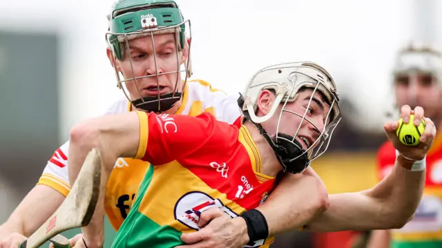 Carlow's Conor Kehoe is challenged by Stephen Rooney in Sunday's game