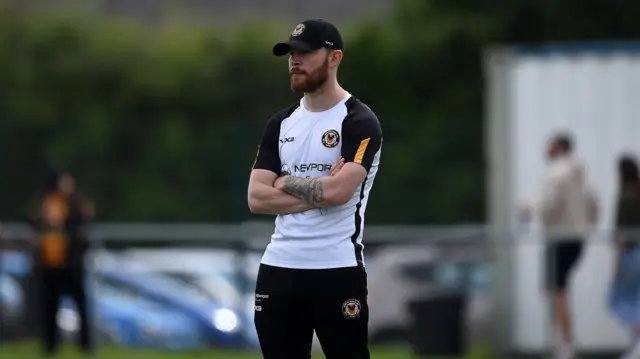 Former Newport County captain and current player liaison officer Mark O'Brien looks on during a training session