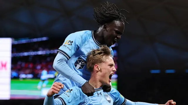 Sydney FC's Joe Lacey celebrates scoring against Wrexham