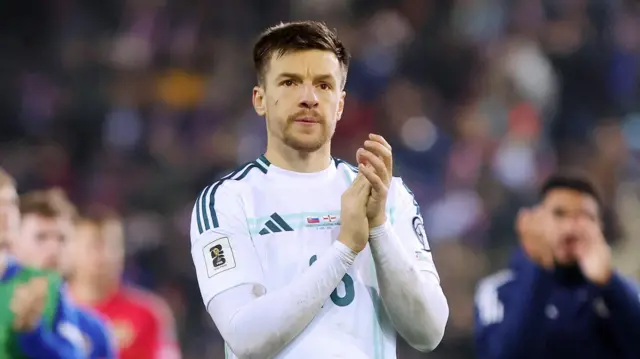 Brad Lyons applauds the Northern Ireland fans in Kosice