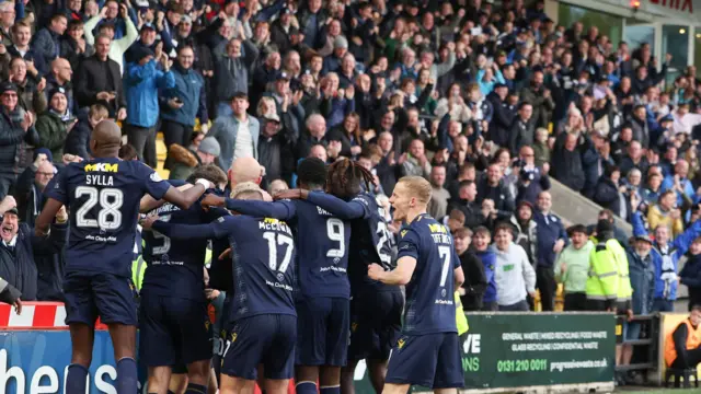 Dundee celebrating in front of fans