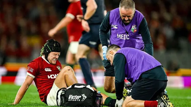 Graham receiving treatment on his ankle 