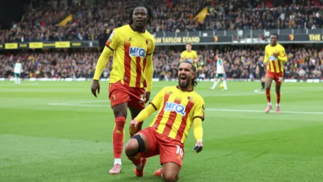 Watford players Kwadwo Baah and Imran Louza celebrating a goal at Vicarage Road. 