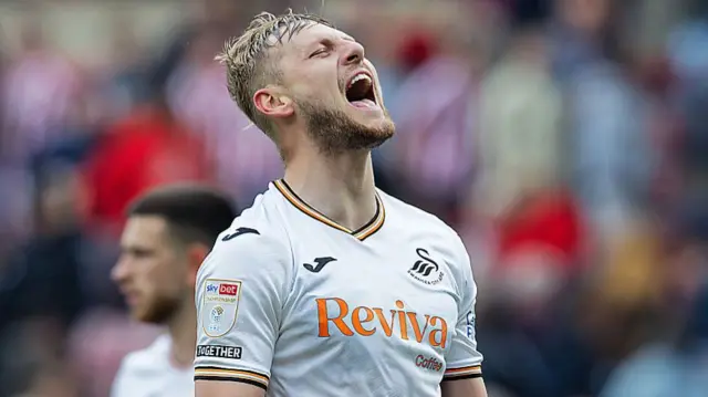 Swansea City centre-back Harry Darling celebrates