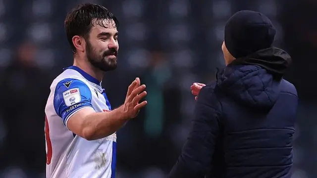 Eiran Cashin of Blackburn Rovers celebrates victory with his interim manager, Damien Johnson following their win over Sheffield Wednesday