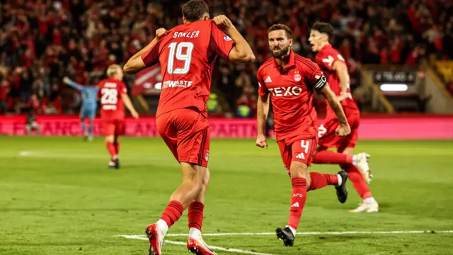 Aberdeen captain Graeme Shinnie & goalscorer Ester Sokler