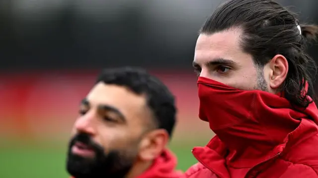 Dominik Szobozslai in training. Mohamed Salah stands behind him.