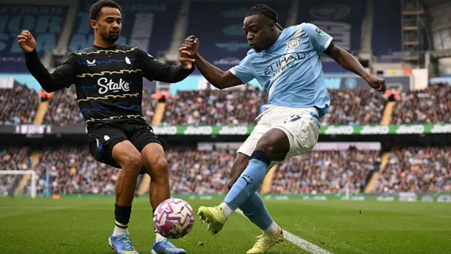 Jeremy Doku attempts to cross the ball past Everton striker Iliman Ndiaye
