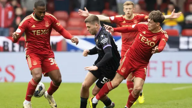 St Johnstone's Connor Smith and Aberdeen's Junior Hoilett and Leighton Clarkson in action during a cinch Premiership match between Aberdeen and St Johnstone