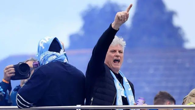 Doug King celebrates on the open top bus during the Coventry City Trophy Parade for winning the Championship