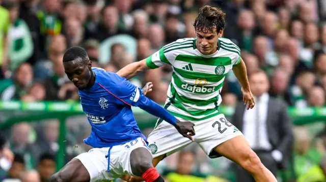 Celtic's Paulo Bernardo (R) and Rangers' Mohamed Diomande in action during a William Hill Premiership match between Celtic and Rangers at Celtic Park