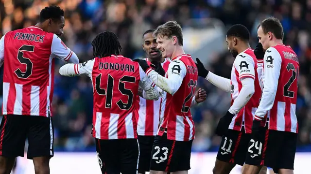 Brentford players celebrate against Sheffield Wednesday in the FA Cup
