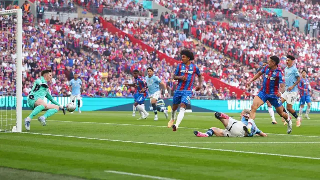 Dean Henderson of saves an acrobatic effort from Erling Haaland during the FA Cup final