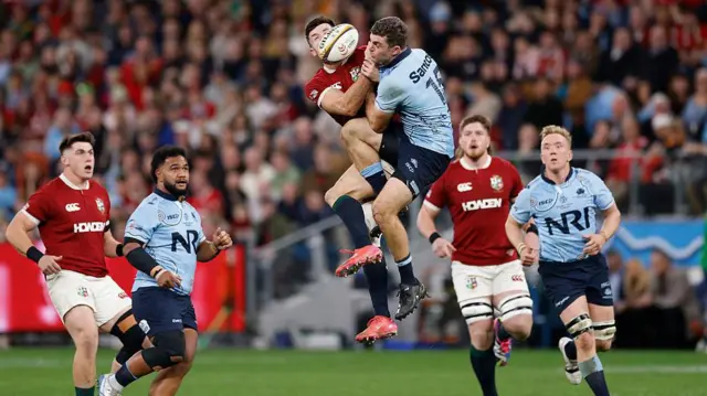 Blair Kinghorn of the British and Irish Lions competes for the ball against Lawson Creighton