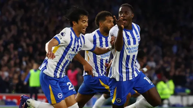 Danny Welbeck celebrates scoring a goal for Brighton